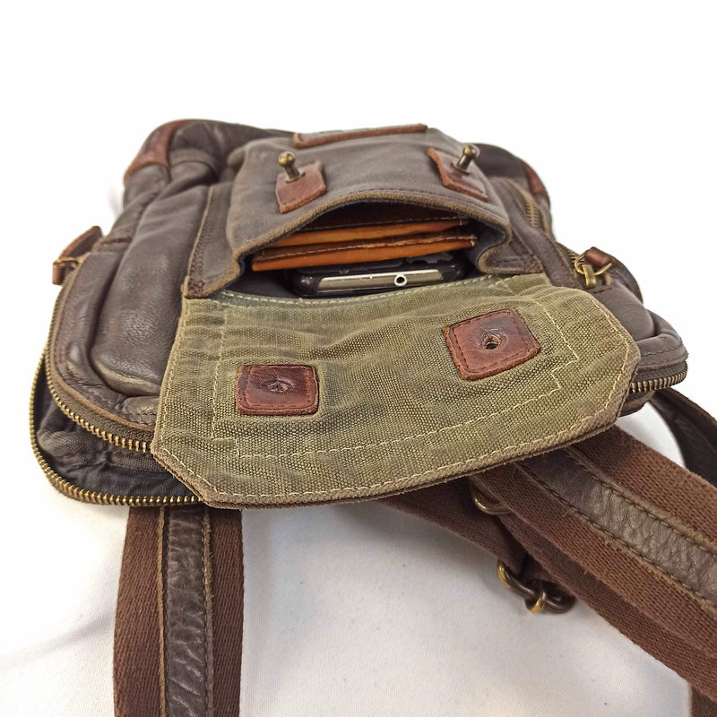 "Leather Flat Tablet CrossBody" shoulder strap with recycled truck tarpaulin details